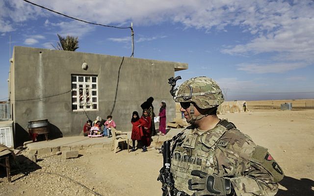 Illustrative:  In this Jan. 27, 2018, file photo, US Army soldiers speak to families in rural Anbar on a reconnaissance patrol near a coalition outpost in western Iraq. (AP Photo/Susannah George, File)