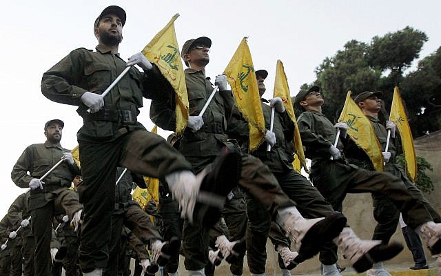 Hezbollah fighters parade during the inauguration of a new cemetery for their fighters who died fighting against Israel, in a southern suburb of Beirut, Lebanon, on November 12, 2010. (AP Photo/Hussein Malla, File)