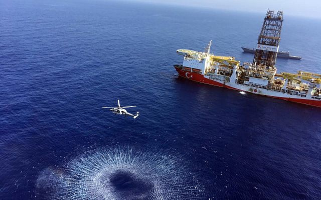 In this photo from July 9, 2019, a helicopter flies near Turkey’s drilling ship, ‘Fatih’ dispatched towards the eastern Mediterranean, near Cyprus. (Turkish Defence Ministry via AP, Pool)