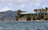 A view of Jeffrey Epstein's stone mansion on Little St. James Island, a property owned by Jeffrey Epstein, is backdropped by St. John Island, Wednesday, August 14, 2019. (AP Photo/Gabriel Lopez Albarran)