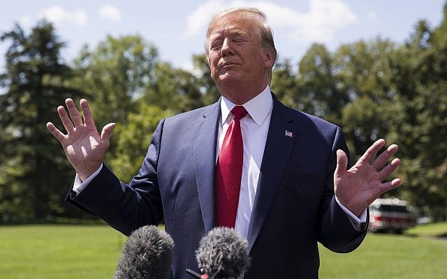 US President Donald Trump pauses while speaking with reporters before departing on Marine One on the South Lawn of the White House, in Washington, August. 21, 2019. (Alex Brandon/AP)