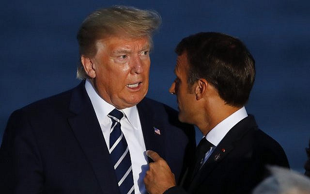 US President Donald Trump (left) talks to French President Emmanuel Macron during the G7 family photo in in Biarritz, France, August 25, 2019. (Francois Mori/AP)