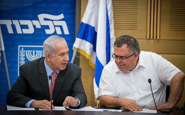 Prime Minister Benjamin Netanyahu and Likud MK David Bitan (R) at a Likud faction meeting at the Knesset on June 12, 2017. (Yonatan Sindel/Flash90)