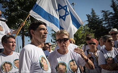 Leah Goldin, right, and her husband Simcha Goldin and other family members and supporters gather outside the state memorial ceremony for Operation Protective Edge at Mount Herzl on July 23, 2019. (Noam Revkin Fenton/Flash90)