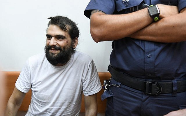 Telegrass founder Amos Dov Silver appears at the Rishon Lezion Magistrate's Court for a remand hearing on August 18, 2019, after being extradited to Israel from Ukraine. (Avi Dishi/Flash90)