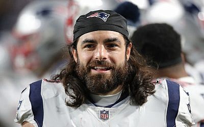 New England Patriots player Nate Ebner smiles on the sidelines during a game against the Buffalo Bills in Buffalo, New York, October 29, 2018. (Tom Szczerbowski/Getty Images/via JTA)