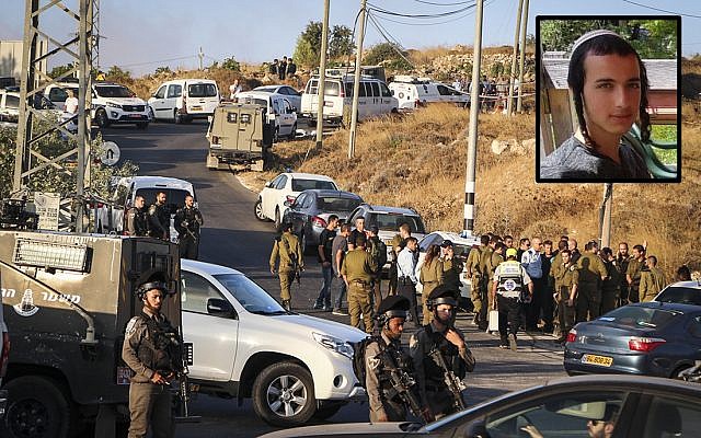 Israeli security forces at the scene where the body of an off-duty, out-of-uniform Israeli soldier Dvir Sorek, upper-right, was found dead with stab wounds, near the settlement of Migdal Oz in the Etzion region, on August 8, 2019. (Gershon Elinson/Flash90)