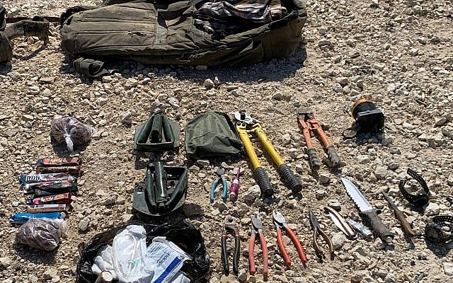This photo released by the IDF shows a collection on weapons, including rifles, RPG launchers, grenades, bold cutters and knives carried by four Gazans who tried to cross the border into Israel, August 10, 2019. (Israel Defense Forces)