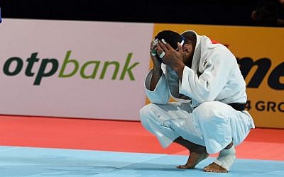 Iranian judoka Saeid Mollaei reacts after losing to Belgium's Matthias Casse in the semifinal fight in the men's under-81 kilogram category during the 2019 Judo World Championships in Tokyo, on August 28, 2019. (Charly Triballeau/AFP)