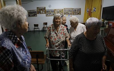 Israeli elderly women take part in a morning workout in a former hotel turned into a social housing building for elderly Israelis from the former Soviet Union, in Jerusalem on September 4, 2019. (Menahem Kahana/AFP)