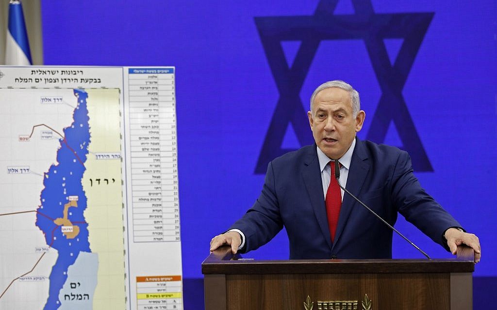 Prime Minister Benjamin Netanyahu speaks before a map of the Jordan Valley as he gives a statement, promising to extend Israeli sovereignty to the Jordan Valley and northern Dead Sea area, in Ramat Gan on September 10, 2019. (Menahem KAHANA / AFP)