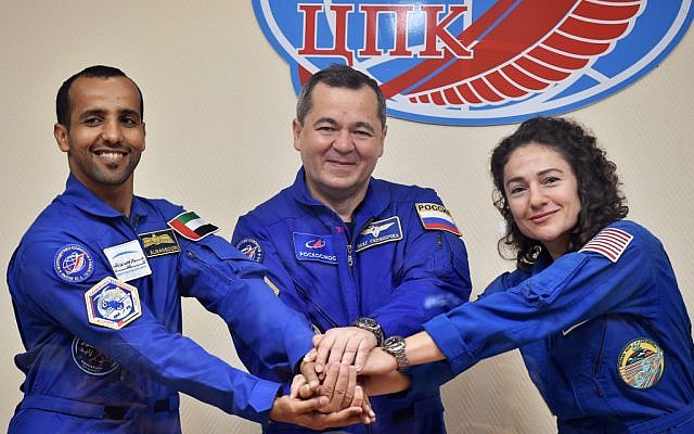 Members of the main crew to the International Space Station (ISS), United Arab Emirates' astronaut Hazza Al Mansouri (left), Russian cosmonaut Oleg Skripochka and US astronaut Jessica Meir pose during a press conference at the Russian-leased Baikonur cosmodrome in Kazakhstan on September 24, 2019. (Vyacheslav OSELEDKO / AFP)