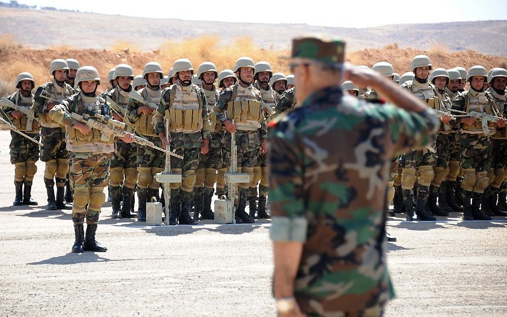 A picture taken during a guided tour with the Russian army shows Syrian elite soldiers taking part in an instruction session with Russian military trainers, on September 24, 2019, at an army base in Yafour, some 30 kilometers west of Damascus. (Maxime POPOV / AFP)