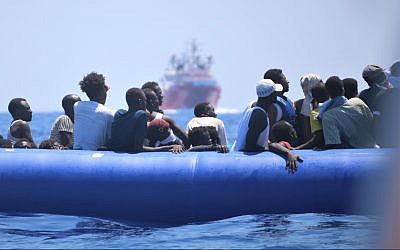 Refugees aboard a blue rubber dinghy soon to be picked up by the Ocean Viking, August 2019. (Hannah Wallace Bowman/SOS Mediterranee)