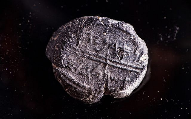 A small 7th century BCE clay sealing reading 'Belonging to Adoniyahu, Royal Steward,' recently discovered in the City of David's sifting project, taken from earth excavated under Robinson's Arch. (Eliyahu Yanai/Courtesy City of David)