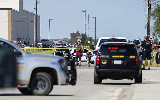 Odessa and Midland police and sheriff's deputies surround the area behind Cinergy movie theater in Odessa, Texas, August 31, 2019, after reports of gunfire (Tim Fischer/Midland Reporter-Telegram via AP)
