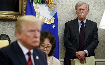 US President Donald Trump, left, meets with South Korean President Moon Jae-In in the Oval Office of the White House in Washington, as then-national security adviser John Bolton, right, watches, May 22, 2018. (Evan Vucci/AP)