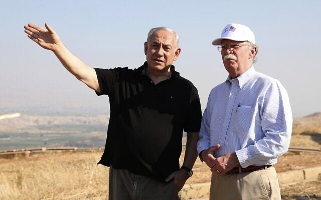 In this photo from, June 23, 2019 file photo, former US National Security Advisor John Bolton, right, and Prime Minister Benjamin Netanyahu, visit an old army outpost overlooking the Jordan Valley between the Israeli city of Beit Shean and the Palestinian city of Jericho. (AP Photo/Abir Sultan, File)