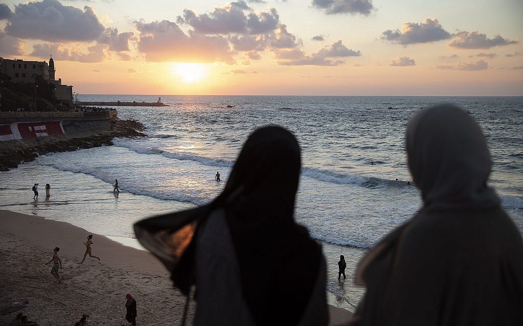 In this photo from September 23, 2019, Two Arab Israeli women overlook the Mediterranean sea, in the mixed Arab and Jewish city of Jaffa, near Tel Aviv. (AP Photo/Oded Balilty)