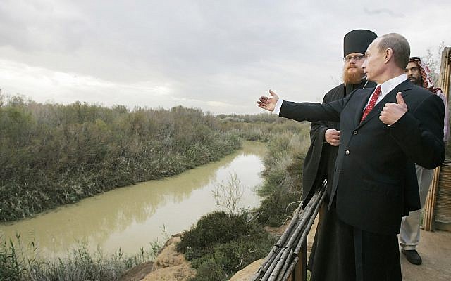 Russian President Vladimir Putin, accompanied by Archimandrite Tikhon, head of the Russian Orthodox mission in Jerusalem, and Jordan's Prince Ghazi, visits the Jordan River at the official baptism site of Jesus in the Jordan Valley during a visit to the holy Christian site, February 13, 2007. (AP Photo/ITAR-TASS, Dmitry Astakhov, Presidential Press Service)