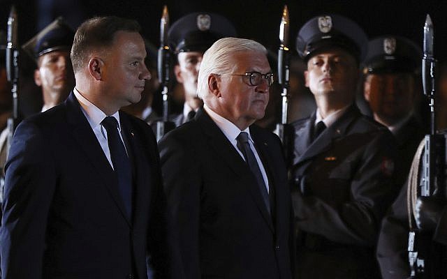 German President Frank-Walter Steinmeier, right, and Polish President Andrzej Duda, left, attend ceremony marking the 80th anniversary of World War II, in Wielun, Poland,  Sept. 1, 2019. (AP Photo/Czarek Sokolowski)