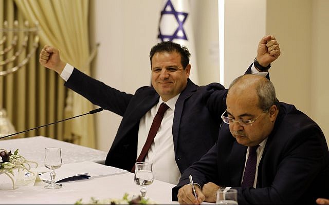 Members of the Joint List Ayman Odeh, left, and Ahmad Tibi consult with President Reuven Rivlin on who should form the the next government, at the President’s Residence in Jerusalem, on September 22, 2019. (Menahem Kahana/Pool via AP)