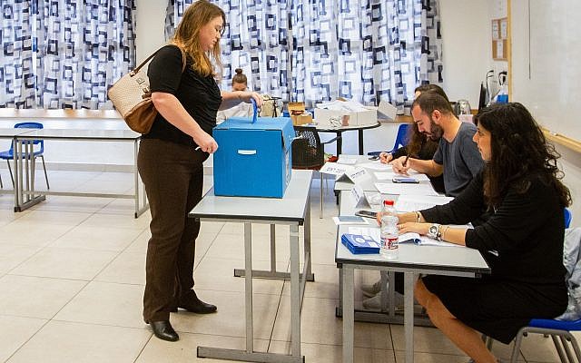 An Israeli votes in Haifa, during the Knesset elections on April 9, 2019. (Meir Vaknin/ Flash90)
