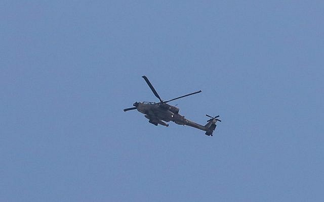 An IDF attack helicopter is seen in the skies above the border between Israel and Lebanon, on September 1, 2019. (David Cohen/Flash90)