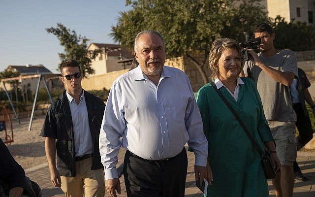 Israel Beytenu party chairman Avigdor Liberman and his wife cast their ballot at a voting station in the settlement of Nokdim, during the Knesset elections on September 17, 2019. (Hadas Parush/Flash90)