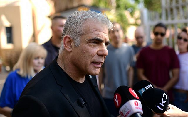Blue and White party MK Yair Lapid speaks to the media after casting his ballot at a voting station in Tel Aviv on September 17, 2019. (Tomer Neuberg/Flash90)