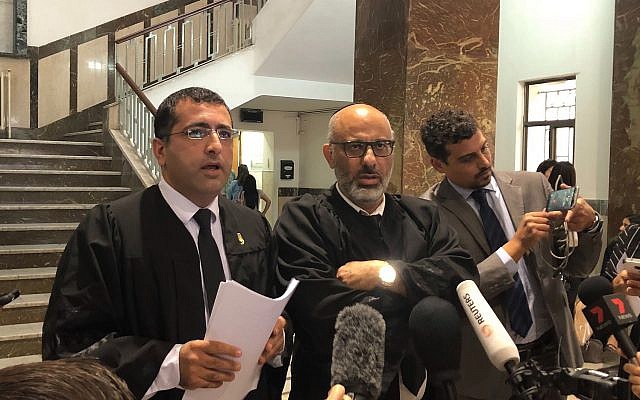 (From L-R) Malka Leifer's attorneys Tal Gabay and Yehuda Fried speak to reporters at the Jerusalem District Court on September 23, 2019. (Jacob Magid/Times of Israel)