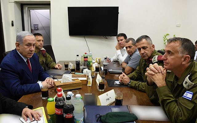 Prime Minister Benjamin Netanyahu (L) is seen with security chiefs at the IDF's Tel Aviv headquarters on September 10, 2019, hours after a rocket attack on Ashdod forced him to run for shelter during a campaign rally (Ariel Hermoni/Defense Ministry)
