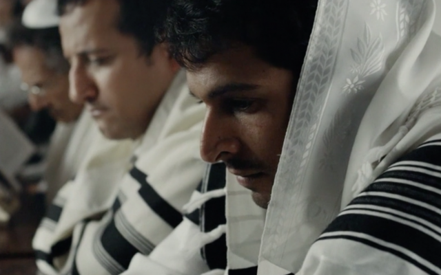 Yehuda Nahari, right, portrays Yigal Amir in the movie 'Incitement.' (Screen capture/Channel 12)