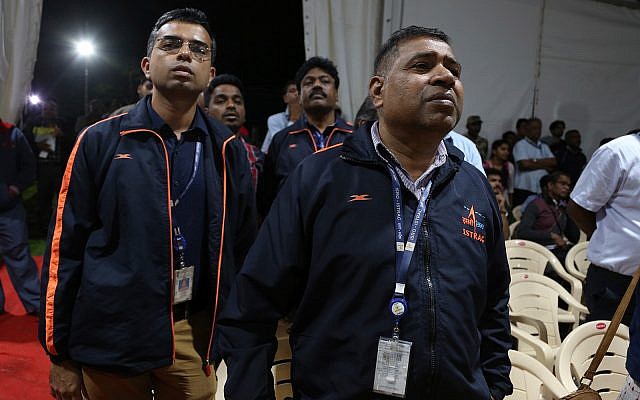 Indian Space Research Organization (ISRO) employees react as they listen to an announcement by organizations's chief Kailasavadivoo Sivan at its Telemetry, Tracking and Command Network facility in Bangalore, India, September 7, 2019. (AP Photo/Aijaz Rahi)