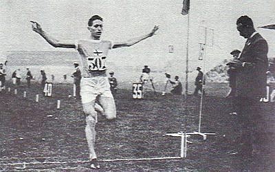 Elias Katz crossing the finish line at the Helsinki Stadium, circa 1920s. (screenshot)