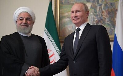 Russian President Vladimir Putin (R) shakes hands with former Iranian President Hassan Rouhani during a meeting of the Supreme Eurasian Economic Council in Yerevan on October 1, 2019. (Alexei Druzhinin/Sputnik/AFP)