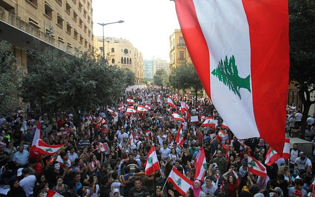 Lebanese demonstrators take part in a protest against dire economic conditions in Lebanon's southern city of Sidon on October 21, 2019.  (IBRAHIM AMRO / AFP)