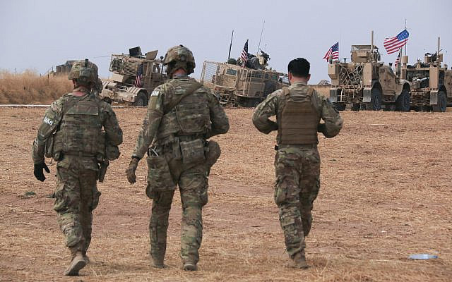 An American military convoy stops near the town of Tel Tamr, north Syria, October 20, 2019. (AP Photo/Baderkhan Ahmad)