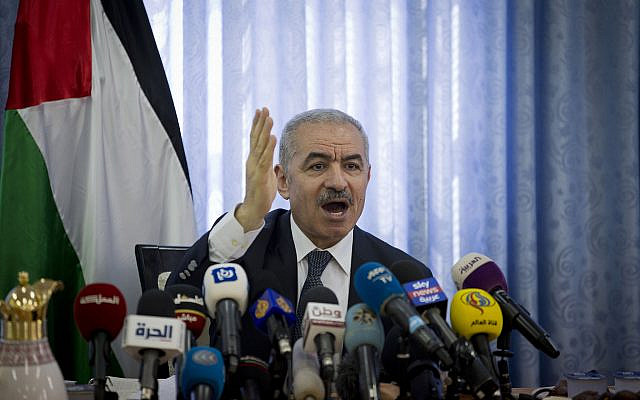 Palestinian Authority Prime Minister Mohammed Shtayyeh chairs a cabinet meeting in the Jordan Valley village of Fasayil, on September 16, 2019. (Majdi Mohammed/AP)