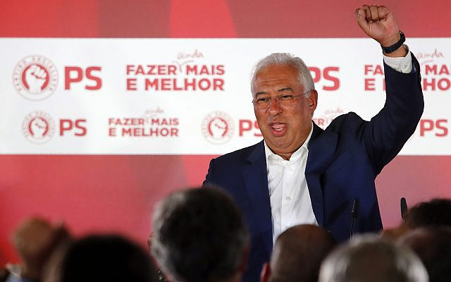 Portuguese Prime Minister and Socialist Party leader Antonio Costa raises his fist while addressing supporters following the announcement of election results in Lisbon Sunday night, Oct. 6, 2019. Portugal's center-left Socialist Party got the most votes in Portugal's general election Sunday, leaving it poised to continue leading the government for another four years. (AP Photo/Armando Franca)
