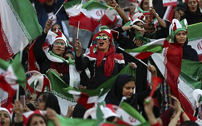 Iranian women cheer during a soccer match between their national team and Cambodia in the 2022 World Cup qualifier at the Azadi (Freedom) Stadium in Tehran, Iran, October 10, 2019. (AP Photo/ Vahid Salemi)