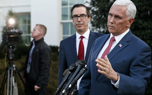 Vice President Mike Pence, with Treasury Secretary Steven Mnuchin, speaks to reporters outside the West Wing of the White House, Monday, Oct. 14, 2019, in Washington. The US is calling for an immediate ceasefire in Turkey's strikes against Kurds in Syria, and is sending Pence to lead mediation effort (AP Photo/Jacquelyn Martin)
