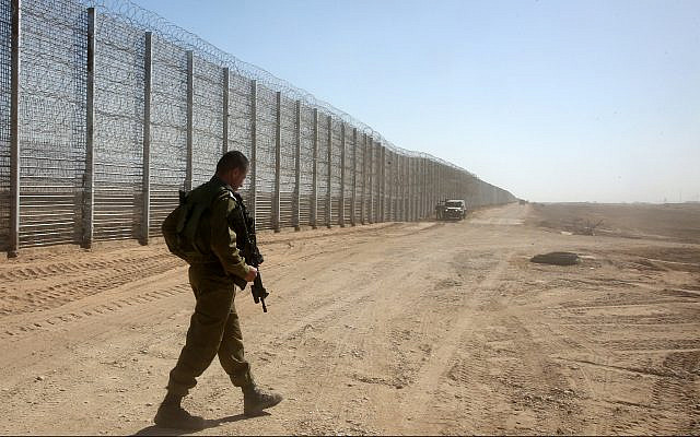 Illustrative: Israeli soldiers guard near the security fence between Israel and Jordan in the Arava Valley in southern Israel, February 9, 2016. (Marc Israel Sellem/Pool/Flash90)