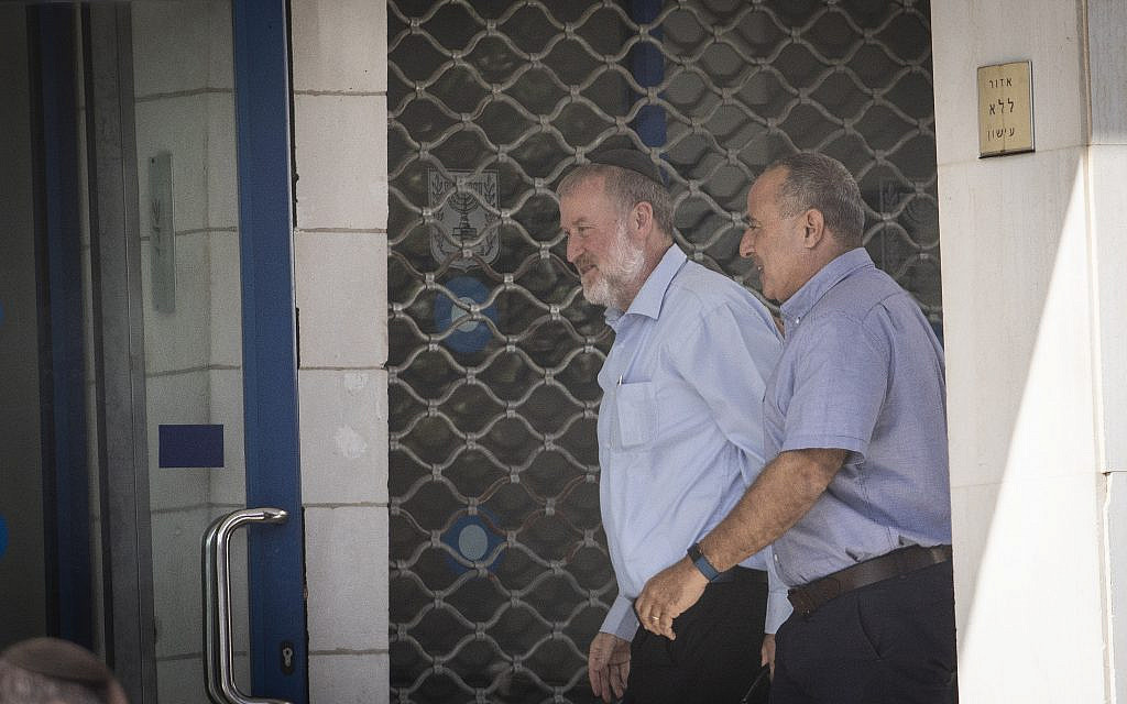Attorney General Avichai Mandelblit,center, arrives at the Justice Ministry in Jerusalem for the hearing on the corruption cases in which Prime Minister Benjamin Netanyahu is a suspect, on October 6, 2019. (Hadas Parush/Flash90)