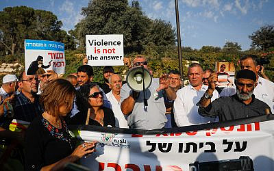 Arab Israelis and supporters demonstrate in front of the prime minister's office in Jerusalem, demanding government action to curb criminal violence in their communities, October 10, 2019. (Yonatan Sindel/Flash90)