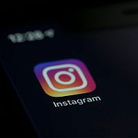Illustrative: the Instagram app icon on the screen of a mobile device in New York, August 23, 2019. (AP Photo/Jenny Kane)