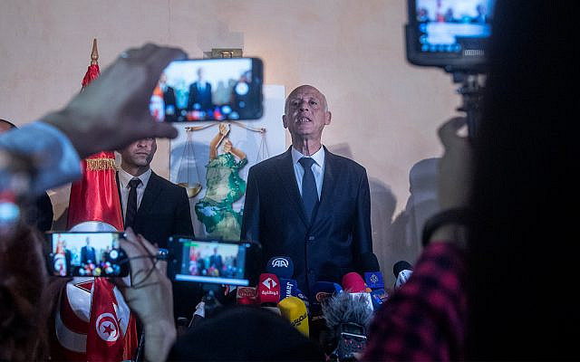 Tunisian presidential candidate and law professor Kais Saied speaks to the reporters and supporters, October 13, 2019 in Tunis. (AP Photo/Mosa'ab Elshamy)