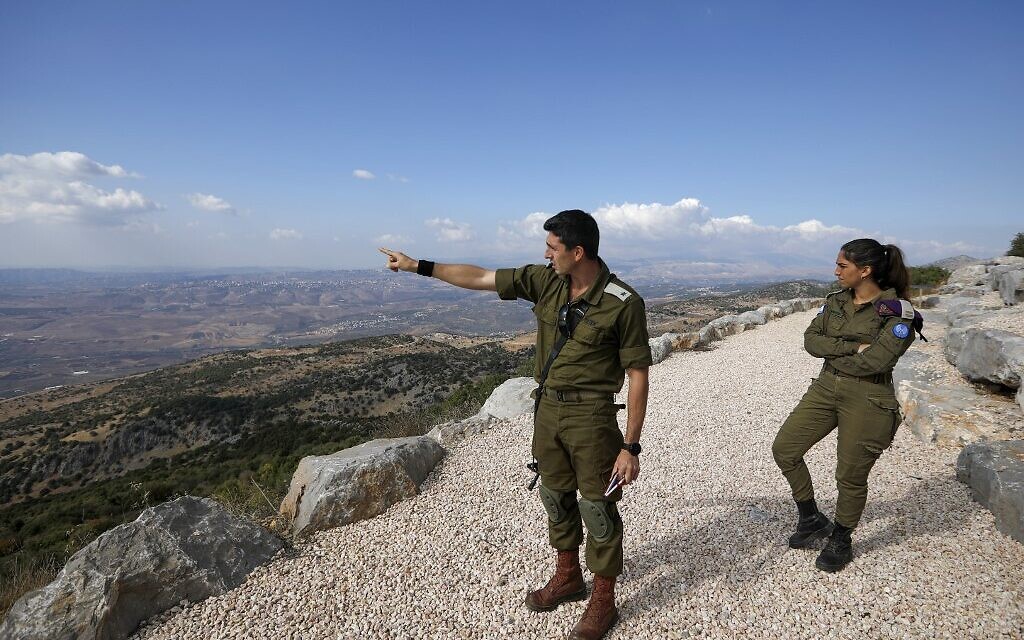 IDF soldier Samuel Boujenah, center, gestures as he explains the Israel-Lebanon conflict to foreign journalists in the military base of Har Dov on Mount Hermon, a strategic and fortified outpost at the crossroads between Israel, Lebanon and Syria, on October 30, 2019. (JALAA MAREY/AFP)