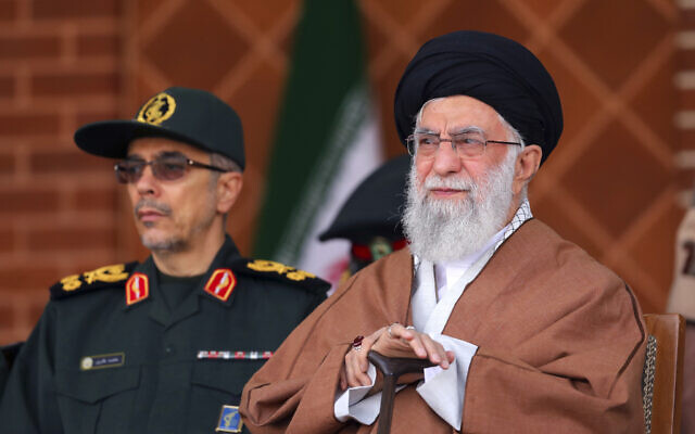 Iranian Supreme Leader Ayatollah Ali Khamenei, right, reviews armed forces with Chief of the General Staff of the Armed Forces Gen. Mohammad Hossein Bagheri, during a graduation ceremony at Iran's Air Defense Academy, in Tehran, Iran, October 30, 2019. (Office of the Iranian Supreme Leader via AP)