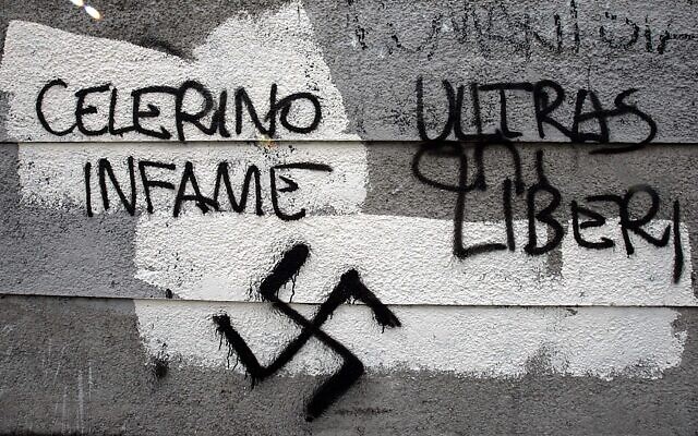 Illustrative: Swastikas and graffiti calling for the release of soccer hooligans and swastikas are seen on a wall outside Rome's Olympic stadium, February 13, 2007. (AP Photo/Gregorio Borgia)